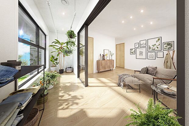 時間・季節・天候に左右されず、自分のリズムで洗濯をしたいという共働きファミリーのライフスタイルに対応する「ソラリティ」。衣類を畳んだり、寛ぎの場などとしても自由に活用できます。(1号棟 内観完成予想図)