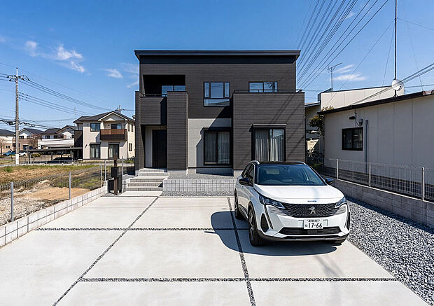 【2号棟:外観完成イメージ】※現地写真にパースを合成したものです