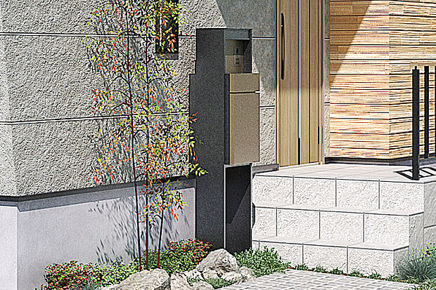 【【宅配ボックス付機能門柱】】不在時に便利な宅配ボックスをはじめ、郵便ポストやインターホンを一体化した機能門柱を設置しました。スリムなデザインと上品なマットのテクスチャーも魅力です。