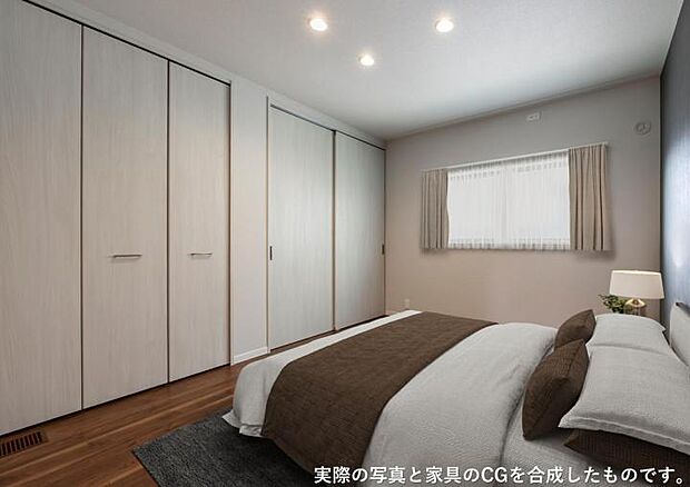 【主寝室【105号地】（2026年3月撮影）】ベットヘッドのクロスがアクセントの主寝室