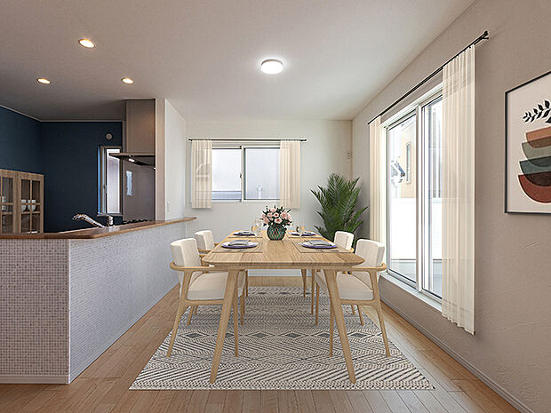 【ダイニング(2号棟)現地+家具CG】ダイニングは家族がいっしょに過ごす大切な空間です。料理をしながら家族の息吹を感じる配置のキッチンとダイニング、ぬくもりに包まれた明るいリビングへ繋がる間取。家族のあたたかな絆が深まります。
