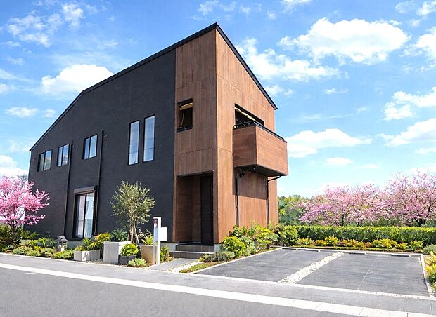 【外観(施工例)】洗練と温もりが調和する上質な住まい、家族の未来を彩る邸宅。やわらかなアイボリー外壁、バルコニー付きの明るく開放的な住まい。