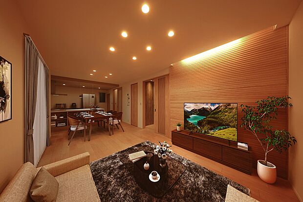 アクセントウォールの質感を際立たせる間接照明が印象的。家族でゆったりとした夜を過ごせそうです。（2号棟※建物は現物となります。生活イメージの喚起のために家具を合成しております。）