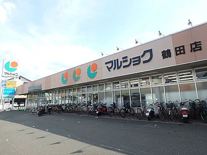 マルショク　鶴田店 550m(7分)