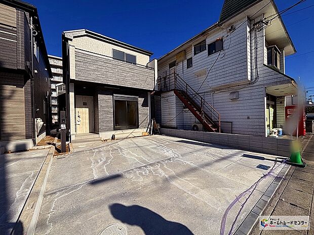 【B号棟外観写真】アースカラーを基調押した落ち着いた外観が洗練とぬくもりを合わせ持つ佇まい。家事をサポートし暮らしに安心とゆとりをもたらす設備仕様。(食器洗浄乾燥機、浴室暖房乾燥機など)くつろぎと機能性を