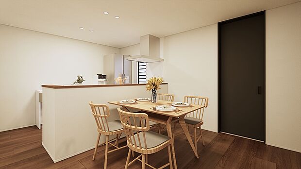 対面キッチンとダイニングがほどよい距離でつながる空間。白と木目でまとめ、ブラックの建具が全体をすっきり引き締めます。