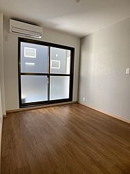 東武伊勢崎線 獨協大学前駅 徒歩13分の賃貸マンション 1階ワンルームのリビング/ダイニング