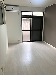 ポルシェ聖蹟桜ヶ丘II 106 1階ワンルームのリビング/ダイニング