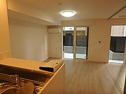 FLAIR・総持寺 1階2LDKのリビング/ダイニング