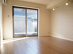 パークサイド千ノ百合 1階1LDKのリビング/ダイニング