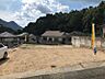 外観：広々とした更地で、建築プランの選択肢が広がります。豊かな自然に囲まれ、落ち着いた住環境が魅力。新しい暮らしをここで始めてみませんか。