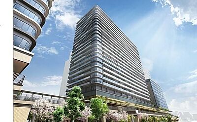 外観：角に丸みを持たせたバルコニーラインが特徴的な高層マンションで、手すりにはガラスパネルが採用されており、敷地周辺には植栽や連絡デッキなどの設備が綺麗に整備された外観デザインとなっています。