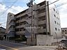 外観：ライオンズマンション長興寺北の外観（北西側から）。阪急宝塚線「曽根」駅徒歩20分。1990年4月築。総戸数16戸の分譲マンションです。