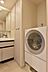 身支度とお洗濯が同時に可能な洗面スペース。雑然としがちな洗面室にはリネン庫を設置。