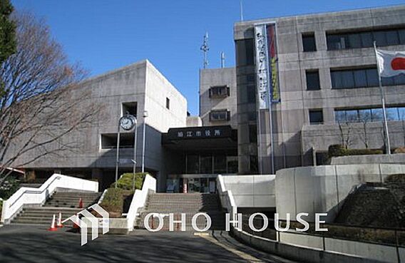 狛江市役所　距...