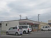 セブンイレブン　甲南町新治店まで1200メートル