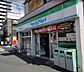 周辺：ファミリーマート牛田関谷駅前店 220m