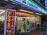 周辺：ファミリーマート 塚本西荻南店（390m）