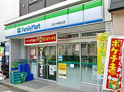 【コンビニエンスストア】ファミリーマート 北区十条西口店まで197ｍ