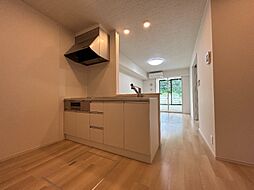 プロムナード　IX 1階1LDKのリビング/ダイニング