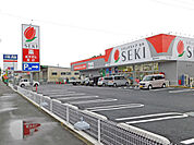 ドラッグストアセキ脚折町店まで915m