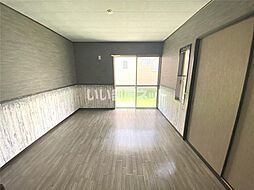 レジデンスブルーム　D 102 1階ワンルームのリビング/ダイニング