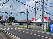 【ドラッグストア】ドラッグストアセキ花野井店まで409ｍ